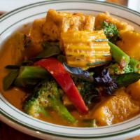 Pumpkin Curry · Asian pumpkin simmered in our red curry, green beans red bell peppers and Thai basil.