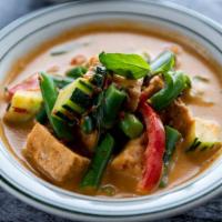 Red Curry · Thai red curry, fresh herbs and spices, coconut milk, green beans, red bell peppers and Thai...