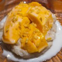 Mango Sticky Rice · Sweet sticky rice and mango topped with coconut cream sauce and roasted mung beans.