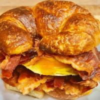 Croissant with Egg, Cheese & Ham, Sausage or Bacon · Choice of ham, sausage or bacon. Choice of cheese.