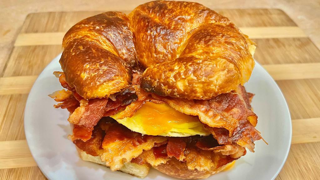 Croissant with Egg, Cheese & Ham, Sausage or Bacon · Choice of ham, sausage or bacon. Choice of cheese.