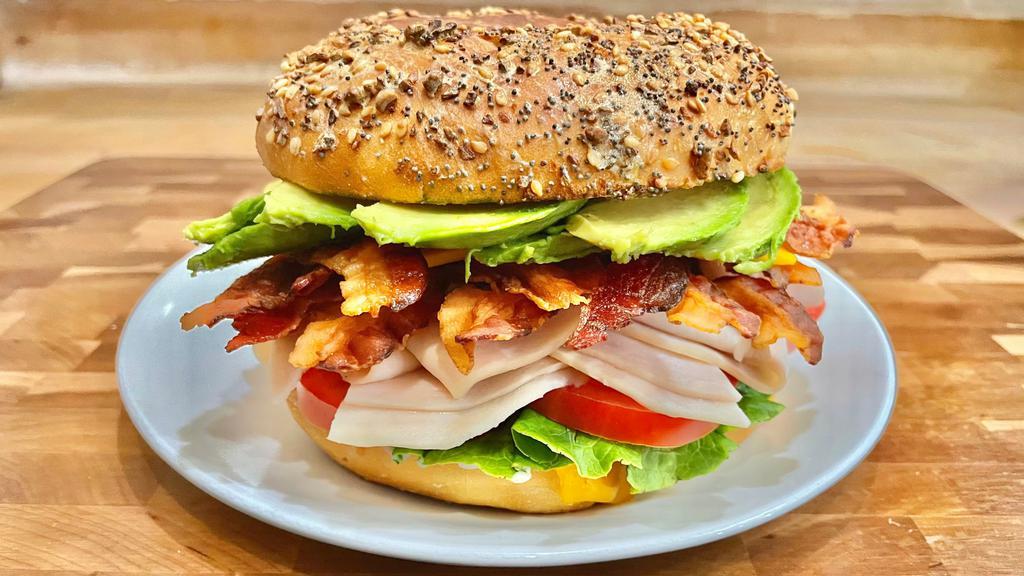 Turkey Bacon Avocado Sandwich · Mayo, mustard, lettuce, tomato, turkey breast, bacon, avocado, and cheese. If the bagels of your choice are not available, you will receive a plain bagel.