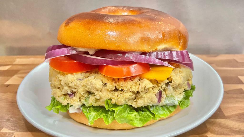 Tuna Salad Sandwich · Lettuce, tomato, onion, cheese, tuna salad. If the bagels of your choice are not available, you will receive a plain bagel.