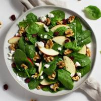 Apple Walnut Salad · Apples, walnuts, cranberries, and goat cheese with your choice of greens and dressing.