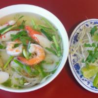 25. Seafood With Rice Noodle Soup · Shrimp, squid, imitation crab and fish ball.