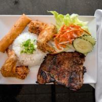 51. Grilled Pork Chop, Fried Chicken Wings & Egg Rolls Over Rice · Combo plate.