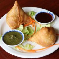  Veg Samosa(2 pieces) · 2 pieces. Fried pastry filled with potatoes and peas served with tamarind and mint chutney.