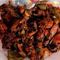 Chicken Chilli · Boneless chicken pan-fried with green chillies, bell pepper, and red onion Nepali style.