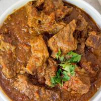 Lamb Curry · Boneless lamb stewed in an onion- and tomato-based sauce, flavoured with ginger, garlic, tom...