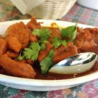 Chicken Vindaloo · Boneless chicken and fresh potatoes cooked in vindaloo sauce made from caramelized onions, c...