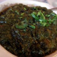 Lamb Saag · Boneless lamb cooked with minced spinach and fresh herbs.