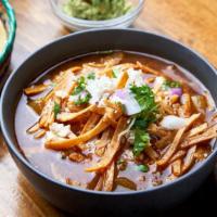 Tortilla Soup · Tender chicken and vegetables in a savory broth with crispy tortilla chips, queso fresco, qu...