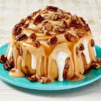 Caramel Pecanbon® · Our signature Classic Roll, topped with decadent caramel frosting and pecans for the perfect...