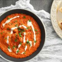 Butter Chicken (Premium) · Roasted shredded chicken from tandoor cooked in creamy tomato sauce with Indian spices.