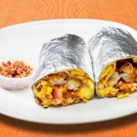 Bacon By Force Burrito · Bacon, eggs, tater tots, cheddar cheese, tomatoes and caramelized onions wrapped in a flour ...