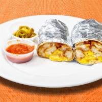 Hot in The Dark Burrito · Spicy eggs, tater tots, spicy jalapenos, hot sauce, cheddar cheese, caramelized onions, toma...