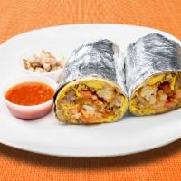 Sausage County Burrito · Sausage, eggs, tater tots, cheddar cheese, tomatoes and caramelized onions wrapped in a flou...