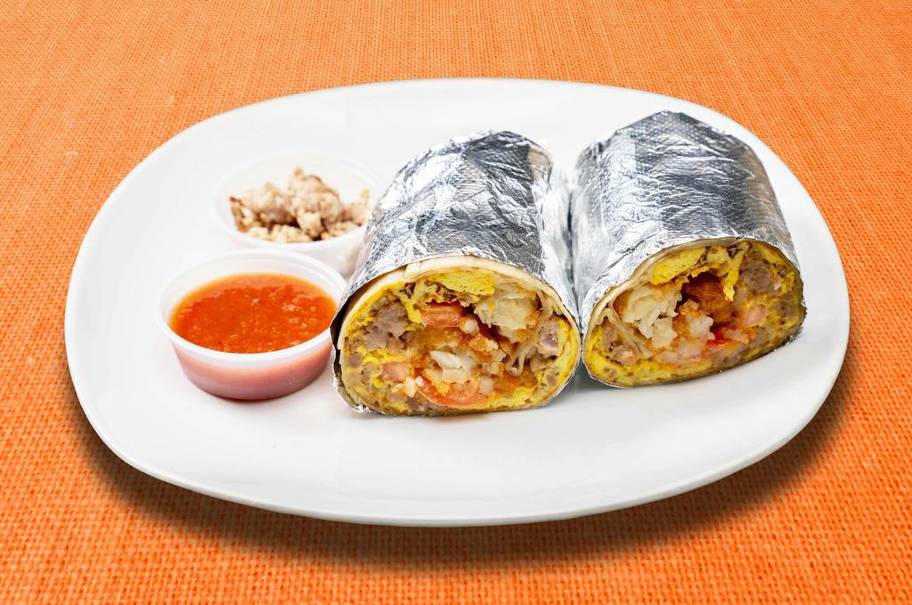 Sausage County Burrito · Sausage, eggs, tater tots, cheddar cheese, tomatoes and caramelized onions wrapped in a flour tortilla.
