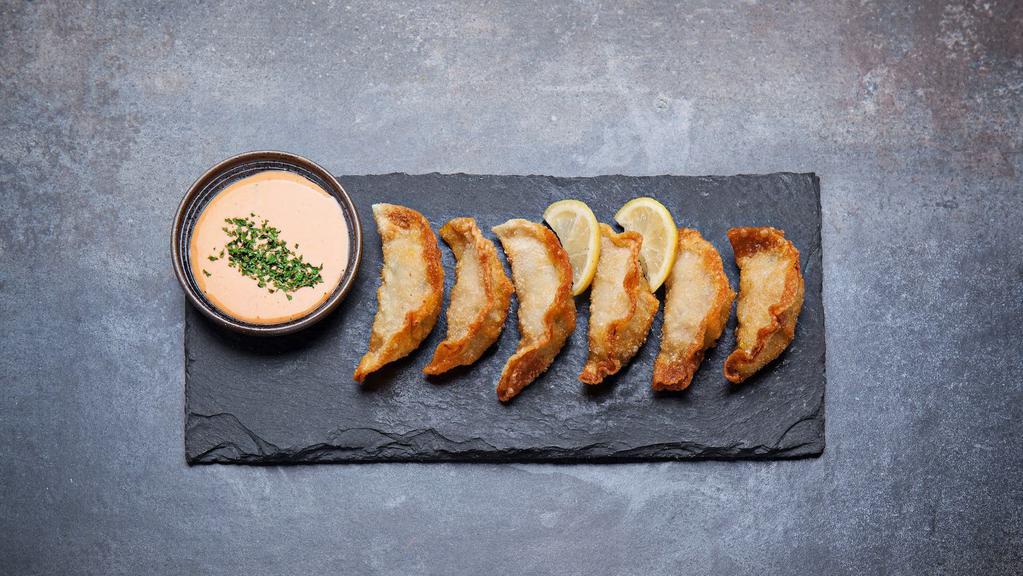 Gyoza (Grilled Or  Fried) (6 Pc) · Six pieces. Hand made juicy pork dumpling.