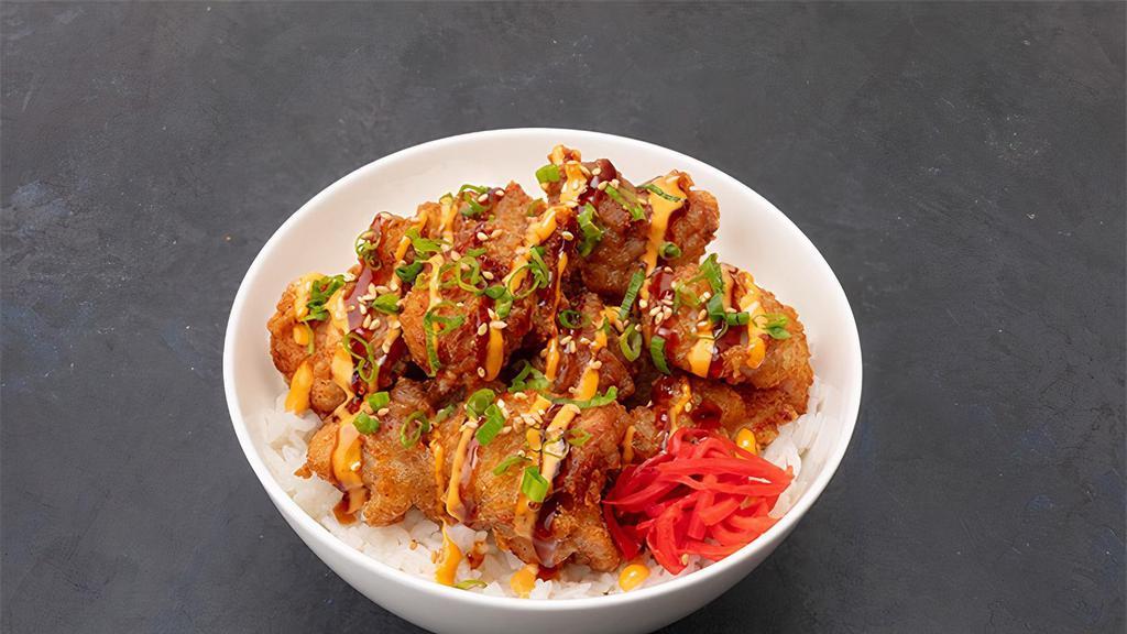 Chicken Karaage Bowl · Japanese style fried chicken, teriyaki sauce, spicy aioli, green onion and red ginger over rice.