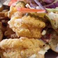 Prawn Po' Boy · Prawns dredged in our Cajun seasoned cornmeal and fried to perfection. Dressed with our Caju...