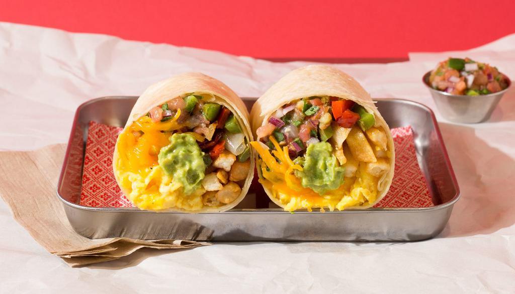 Vegetarian California Burrito · Breakfast burrito filled with eggs, cheese, fries, pico de gallo, and guacamole, and served with a side of salsa.