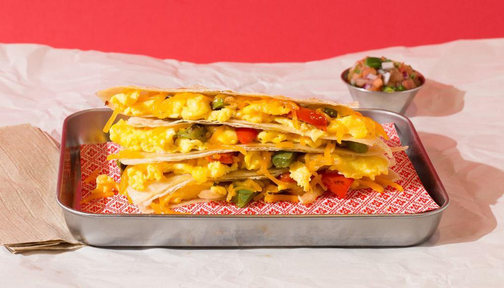 Vegetarian Breakfast Quesadilla · Breakfast quesadilla filled with sauteed onions and peppers, eggs, melted cheese, pico de gallo, and served with a side of salsa.