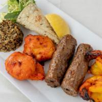 Tandoori Kebab Sampler · Seekh kebab, red chili chicken tikka, and salmon.