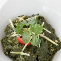 Saag Paneer · Cumin, garlic spiced spinach, and cottage cheese.