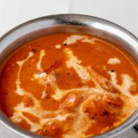 Butter Chicken · Shredded tandoori chicken in a slowly simmered tomato sauce.