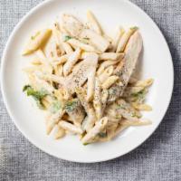 Unbelievable Chicken Alfredo · Grilled chicken, and spinach cooked in pasta with Alfredo sauce. Garnished with basil.