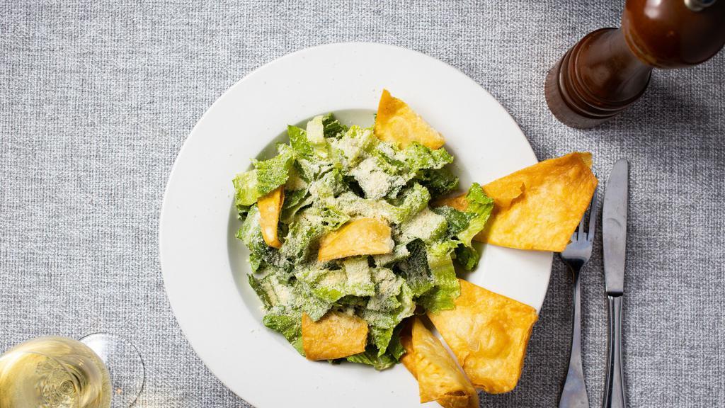Julius Caesar Salad · Refreshing green salad with a mix of romaine lettuce, croutons dressed with lemon juice, olive oil, & Caesar's dressing.