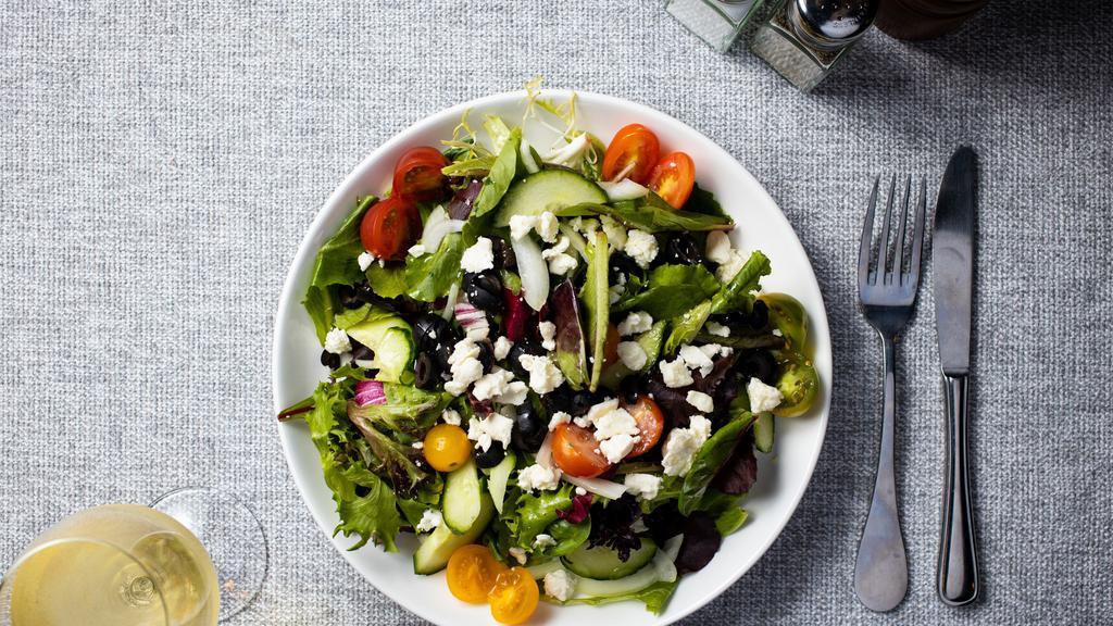 Greek Salad · Romaine lettuce with English cucumbers, red onions, kalamata olives, cherry tomatoes, feta cheese and mustard vinaigrette.