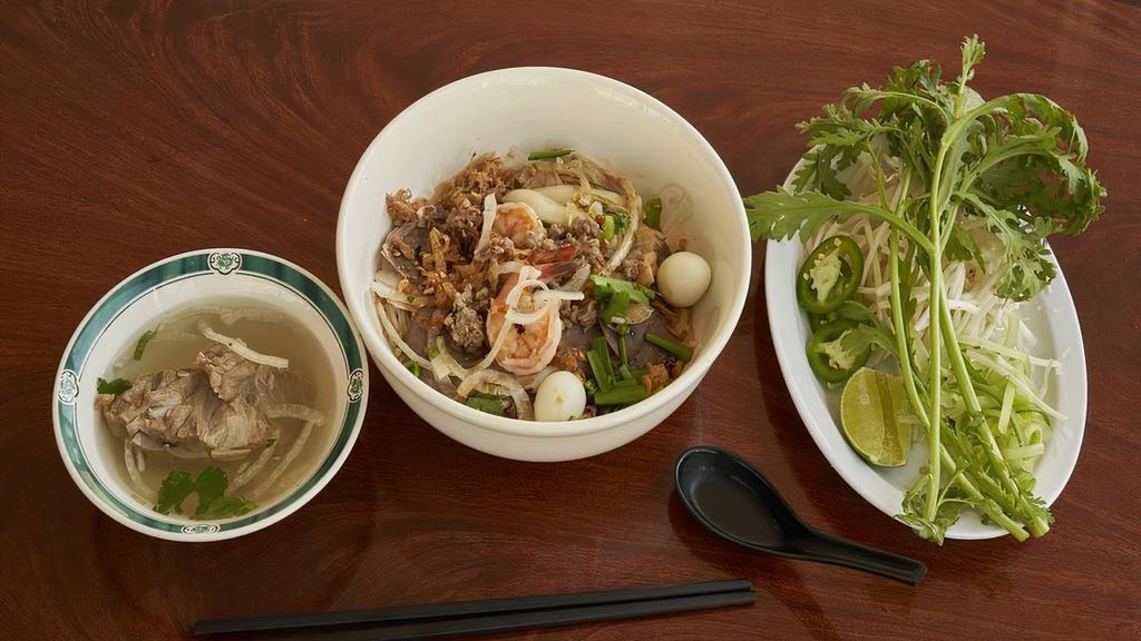 29. Dry Noodle / Hu Tieu Nam Vang (Kho) · Shrimp, squid, slice pork, pork cake, heart, ground pork and quail egg with rice noodle. (Dry).