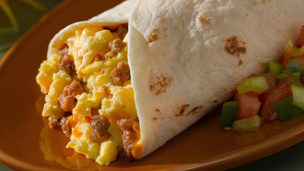 Breakfast Burrito · Two eggs with rice, beans, cheese and your choice of ham, bacon, mexican sausage or potatoes.
