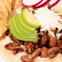 Super Taco · Hand made tortilla, with your choice of meat, whole beans, sour cream, pico de gallo, avocad...