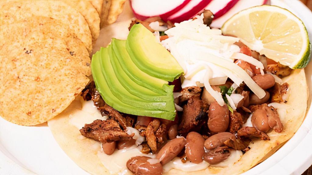 Super Taco · Hand made tortilla, with your choice of meat, whole beans, sour cream, pico de gallo, avocado, and cheese.