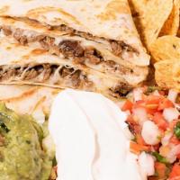 Super Quesadilla · Melted cheese in a grilled flour or corn tortilla with your choice of meat or veggies. Guaca...