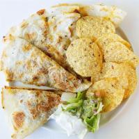 Regular Quesadilla · Melted cheese in a grilled flour or corn tortilla.