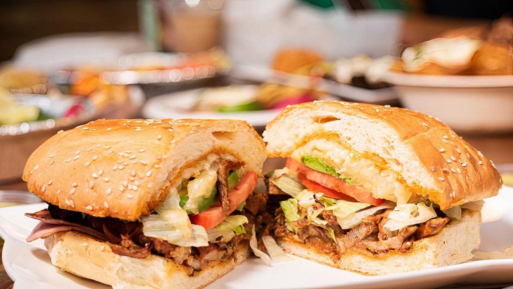 Torta Regular · Refried beans, lettuce, tomato, avocado, jalapeno, chipotle mayo, cheese and your choice of meat.
