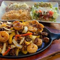 Mixed Fajitas · Steak, Chicken, & Shrimp mixed with bell pepper, onions and mushrooms. Lettuce, pico de gall...
