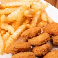 Chicken Nuggets · Chicken nuggets with french fries or rice and beans on the side.