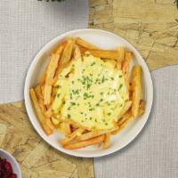 Cheese Fries · Golden potatoes deep-fried to perfection and topped with cheese.