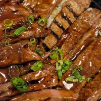 Beef Teriyaki Donburi   
 · charbroiled strips of beef with teriyaki sauce.