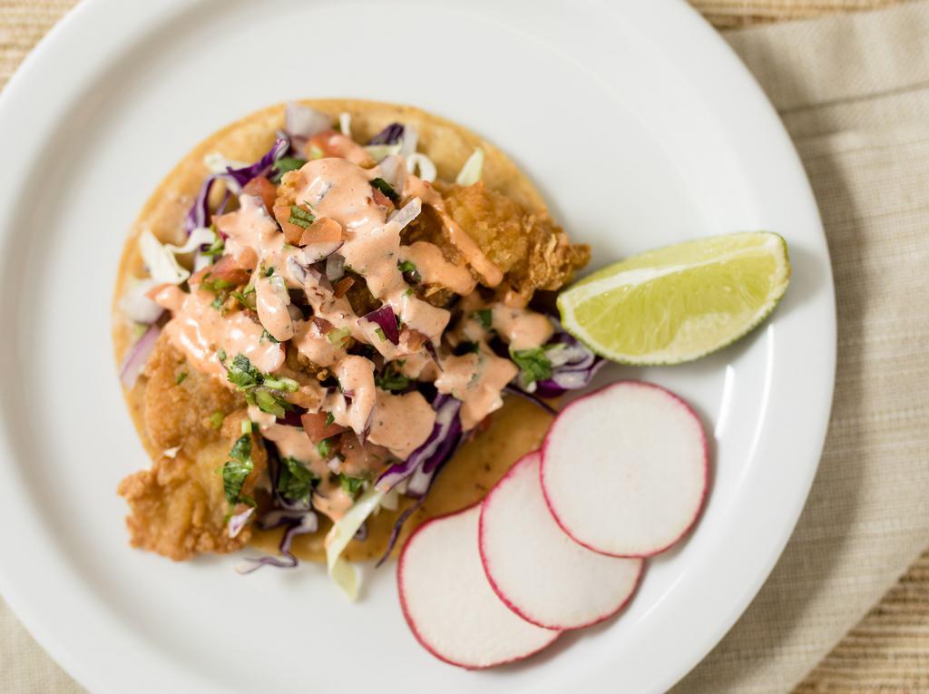 Baja Fish Taco · Breaded fish, topped with pico de gallo, cabbage and spicy house dressing.