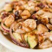 Aguachile Sinaloense · Raw shrimp, scallops, and octopus pickled in lime juice. Tossed with choice of sauce, cucumb...