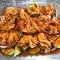Aguachile Rojo · Raw shrimp pickled in lime juice, tossed with extra spicy red sauce, cucumber and onion, top...