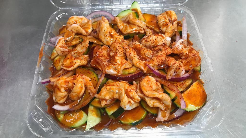Aguachile Rojo · Raw shrimp pickled in lime juice, tossed with extra spicy red sauce, cucumber and onion, topped with chili powder.