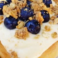Blueberry Pie Roll · cream cheese frosting, topped with blueberries and pie crumble