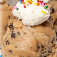 Confetti Cookie Dough Scoop · Chocolate Chip Cookie Dough Scoop with vanilla frosting topped with sprinkles.